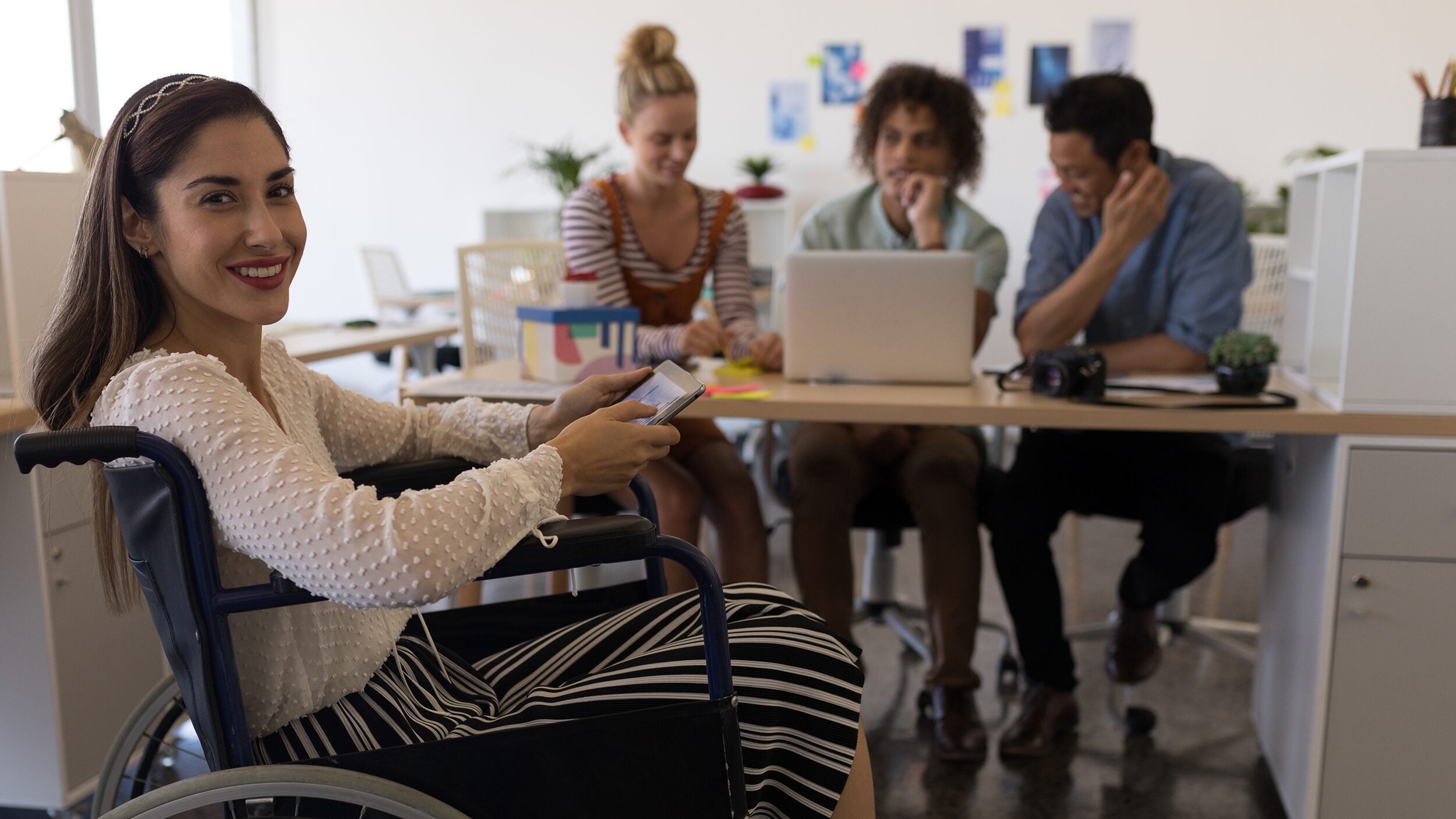 Students working together on a laptop.